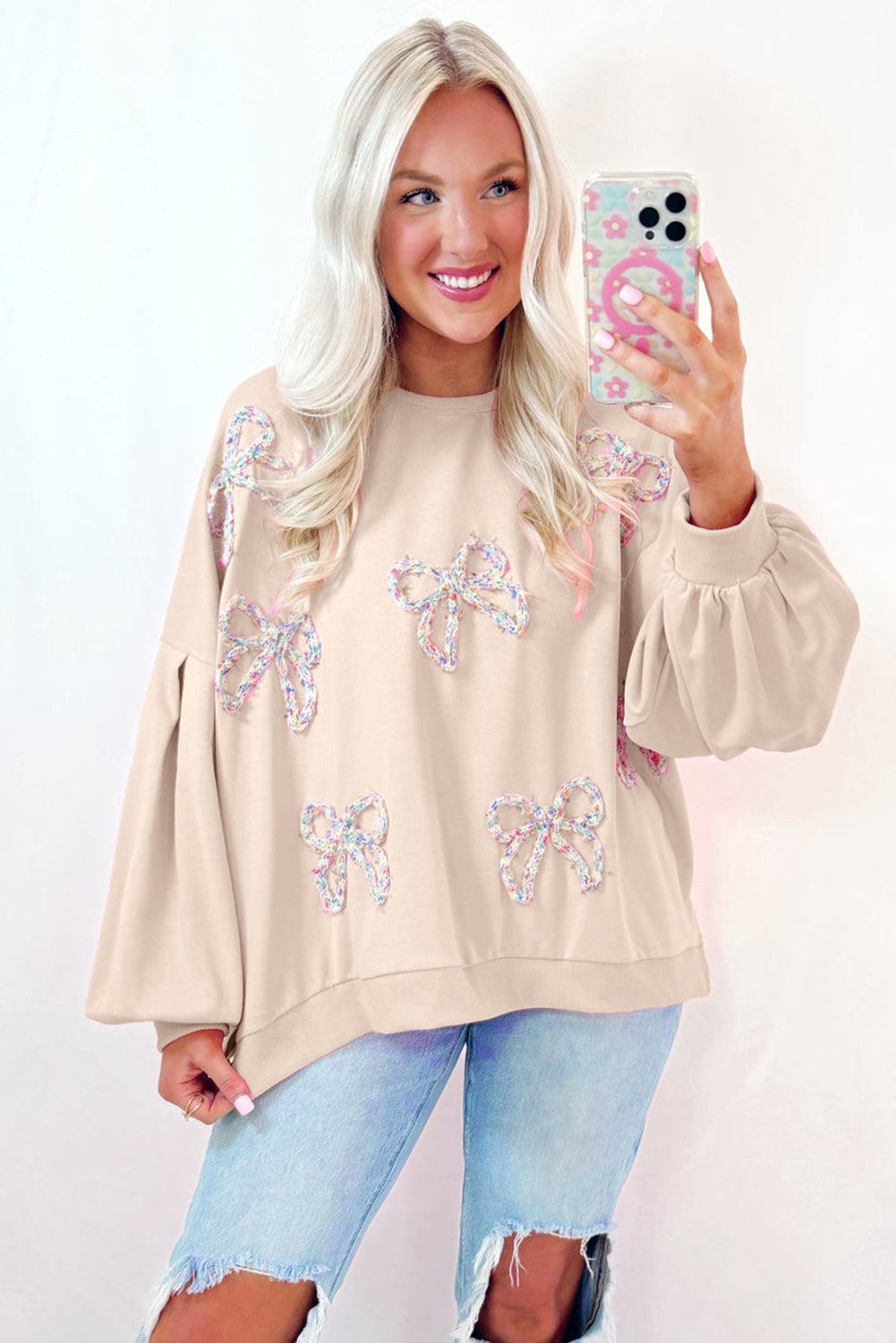 Mommas Hive oversized pullover sweatshirt with parchment color, embroidered bow lantern sleeves, made of polyester and cotton blend.