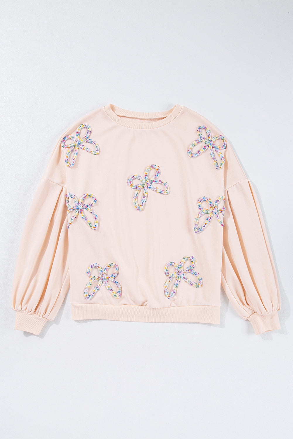 Mommas Hive oversized sweatshirt with parchment color, embroidered bow and lantern sleeves, made of polyester and cotton blend.