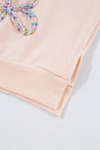 Mommas Hive oversized sweatshirt with parchment color, embroidered bow detail, lantern sleeves, made of polyester and cotton.