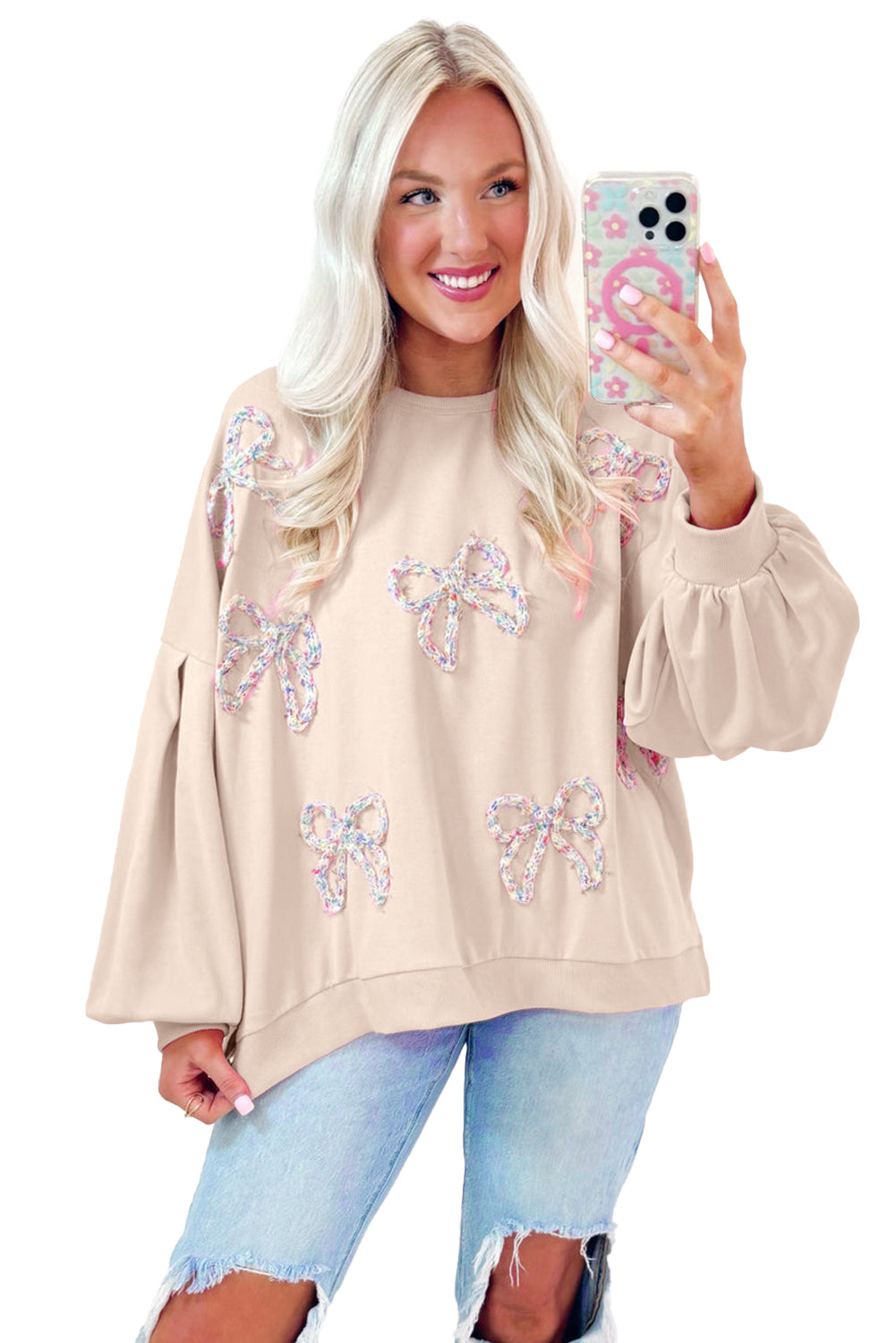 Mommas Hive oversized pullover sweatshirt with parchment color, embroidered bow detail, lantern sleeves, made of polyester and cotton.