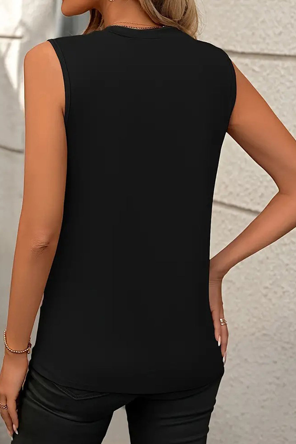 White crew neck pleated tank top from Mommas Hive, featuring a stylish sleeveless design and comfortable fabric blend.