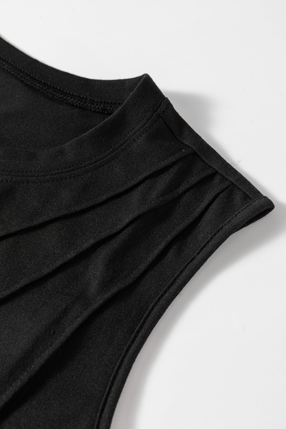 White crew neck pleated tank top from Mommas Hive, featuring a stylish design and comfortable fabric blend of polyester, cotton, and elastane.