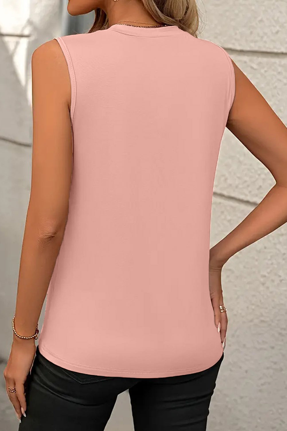 White crew neck pleated tank top by Mommas Hive, sleeveless with a flowy pleated design, made from polyester, cotton, and elastane.