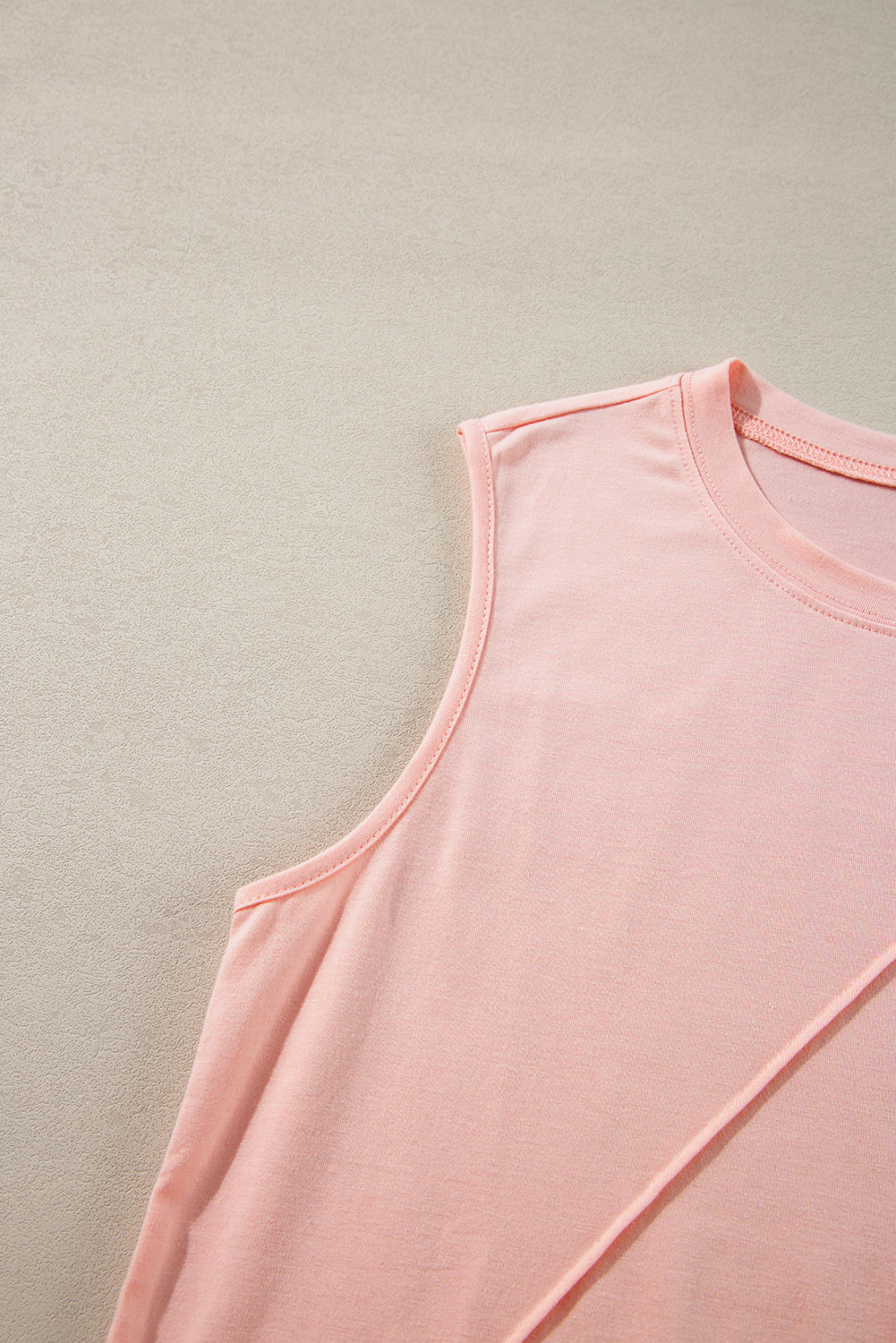 White crew neck pleated tank top from Mommas Hive, sleeveless top with a feminine pleated design, made of polyester, cotton, and elastane.