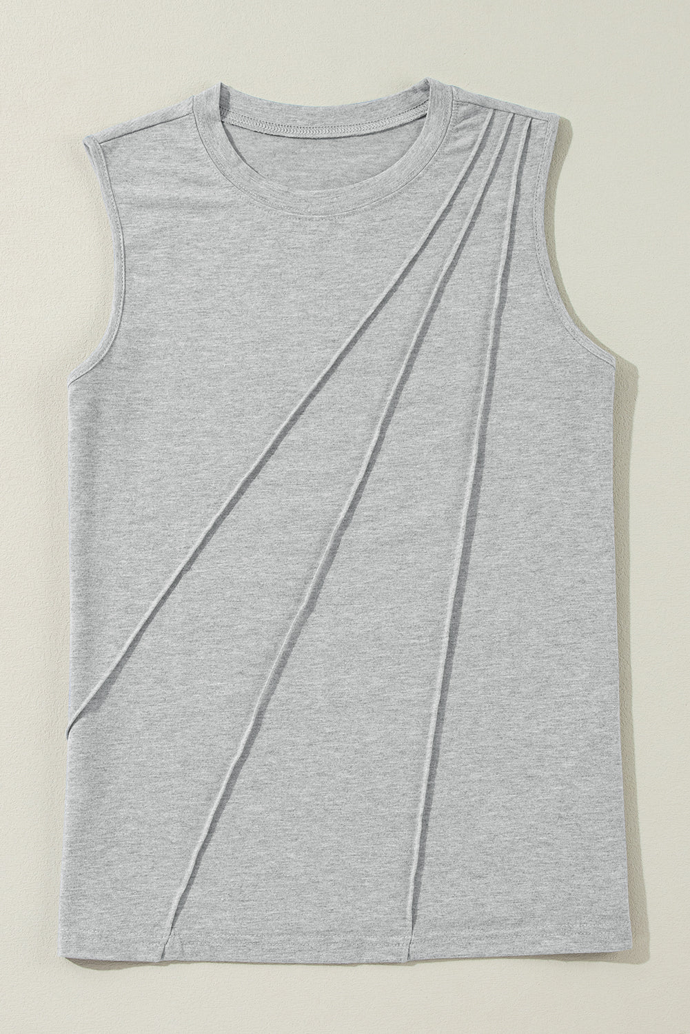 White crew neck pleated tank top from Mommas Hive, featuring a sleeveless design and lightweight fabric for a casual look.