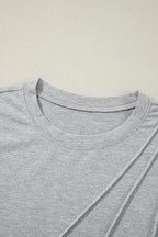 White crew neck pleated tank top from Mommas Hive, made of polyester, cotton, and elastane, shown on a hanger.
