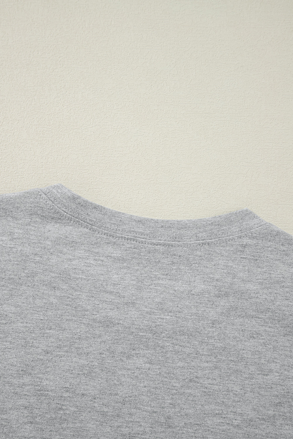 White crew neck pleated tank top by Mommas Hive, made of polyester, cotton, and elastane, displayed on a plain background.