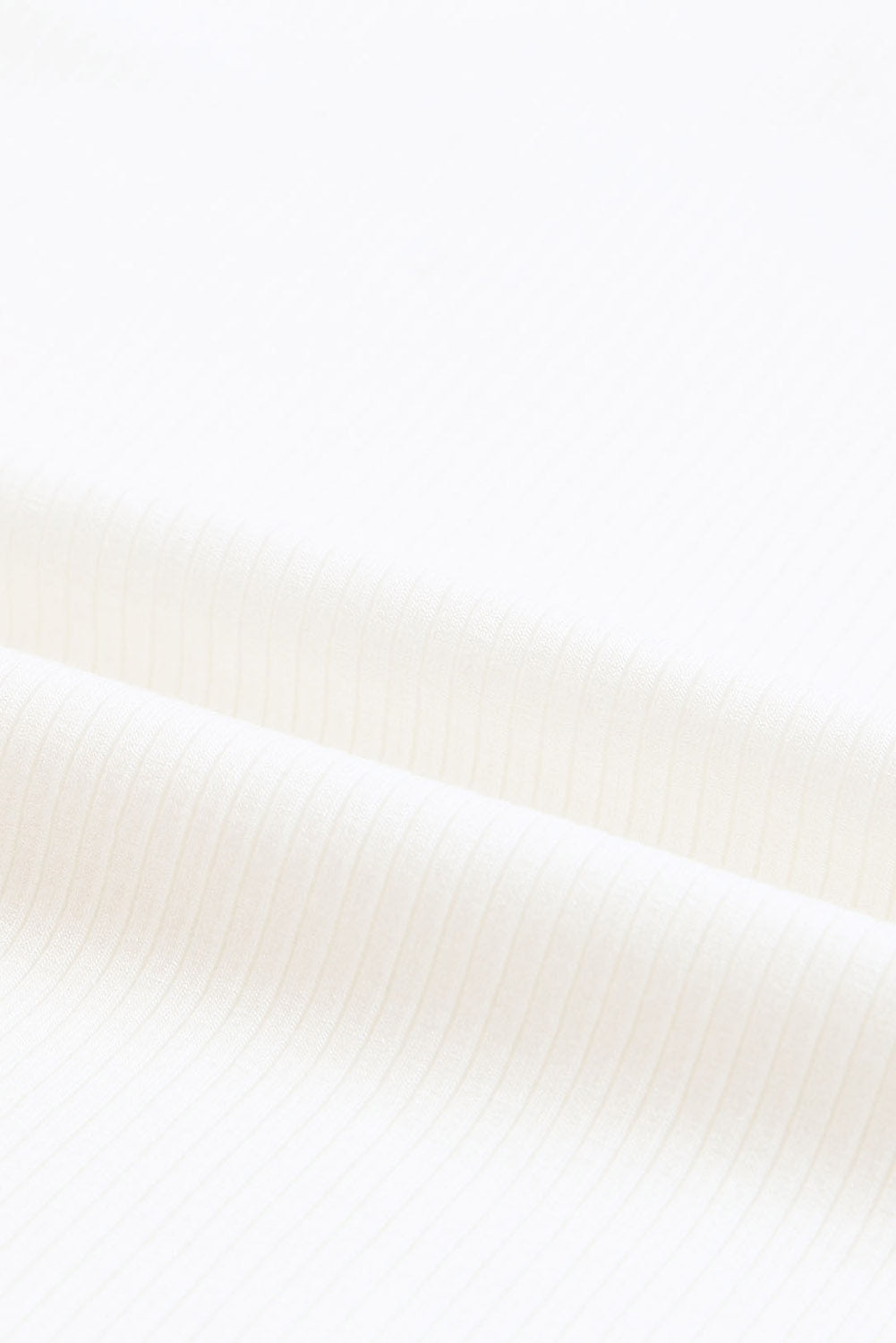 White dotty mesh ruffle sleeve ribbed knit top from Mommas Hive, featuring lightweight fabric and stylish ruffle details.