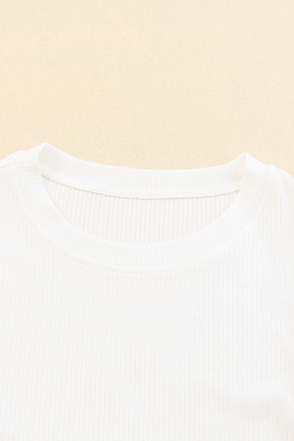 White Dotty Mesh Ruffle Sleeve Ribbed Knit Top from Mommas Hive, featuring ruffle sleeves and a textured knit fabric.