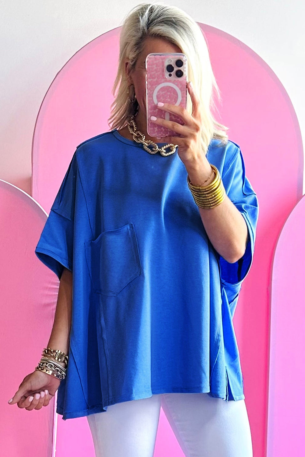 Blue oversized T-shirt by Mommas Hive with patched pocket and exposed seams, made from polyester, cotton, and elastane.