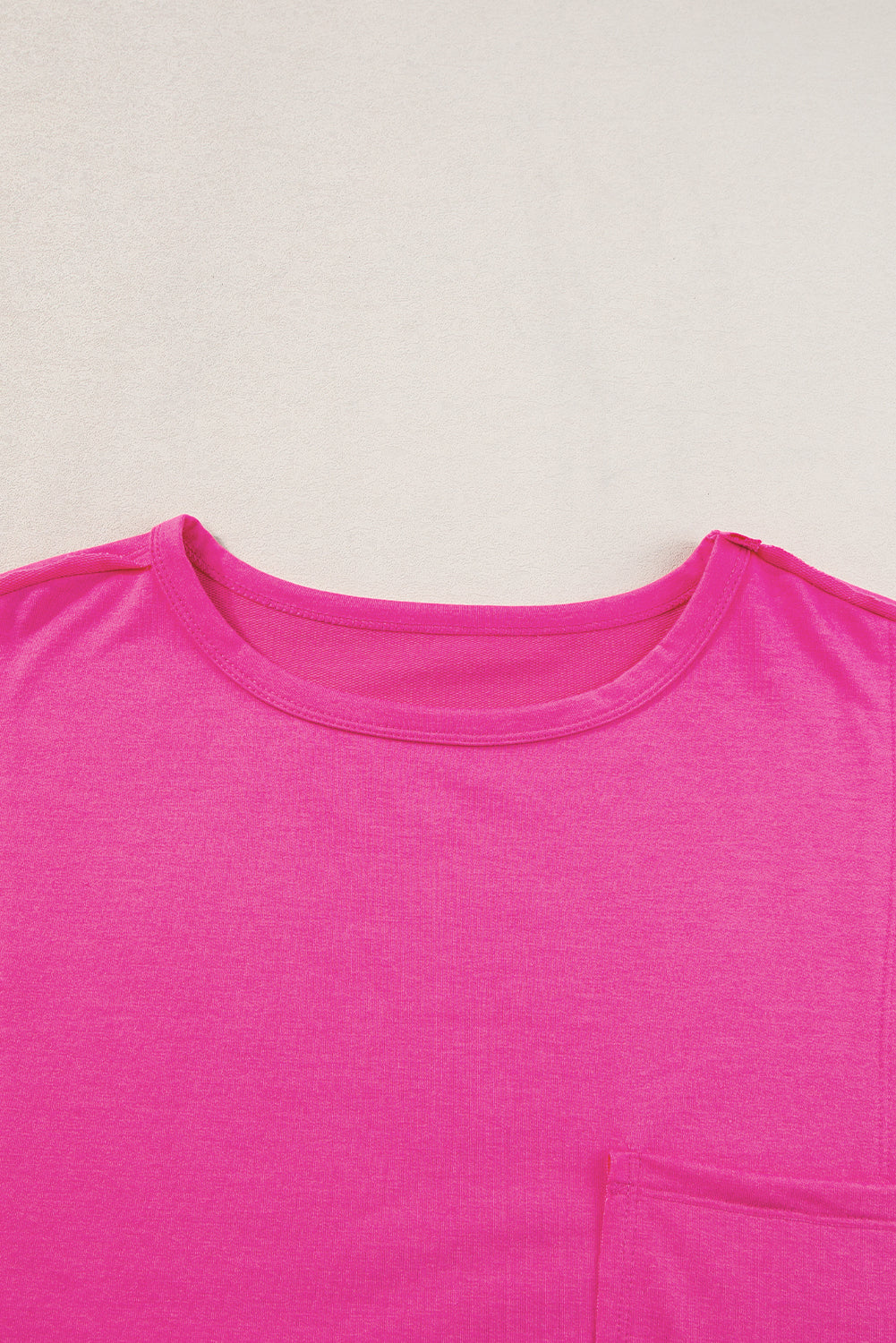 Blue oversized T-shirt by Mommas Hive with patched pocket and exposed seams, made of polyester, cotton, and elastane.