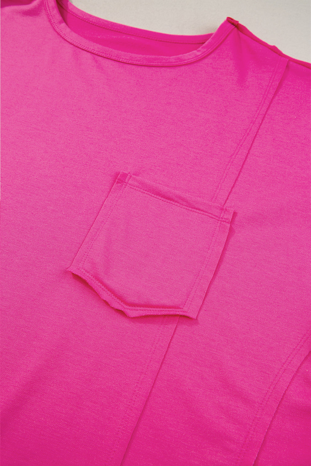Blue oversized T-shirt from Mommas Hive with patch pocket and exposed seam detail, made from polyester, cotton, and elastane.
