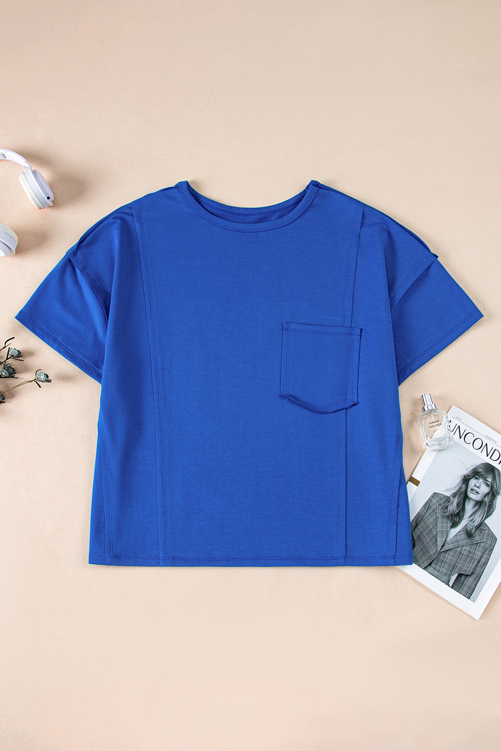 Blue oversized T-shirt by Mommas Hive with patched pocket and exposed seams, made of polyester, cotton, and elastane.