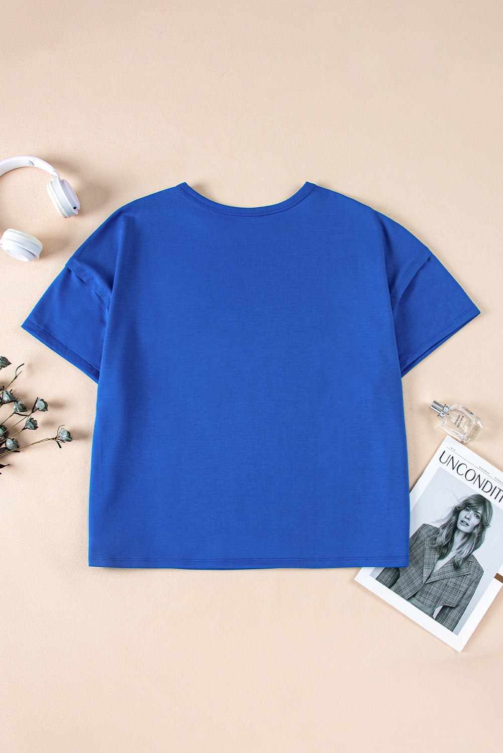 Blue oversized T-shirt from Mommas Hive with patched pocket and exposed seam details, made of polyester, cotton, and elastane.