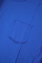 Blue oversized T-shirt by Mommas Hive with patched pocket and exposed seam, made of polyester, cotton, and elastane.
