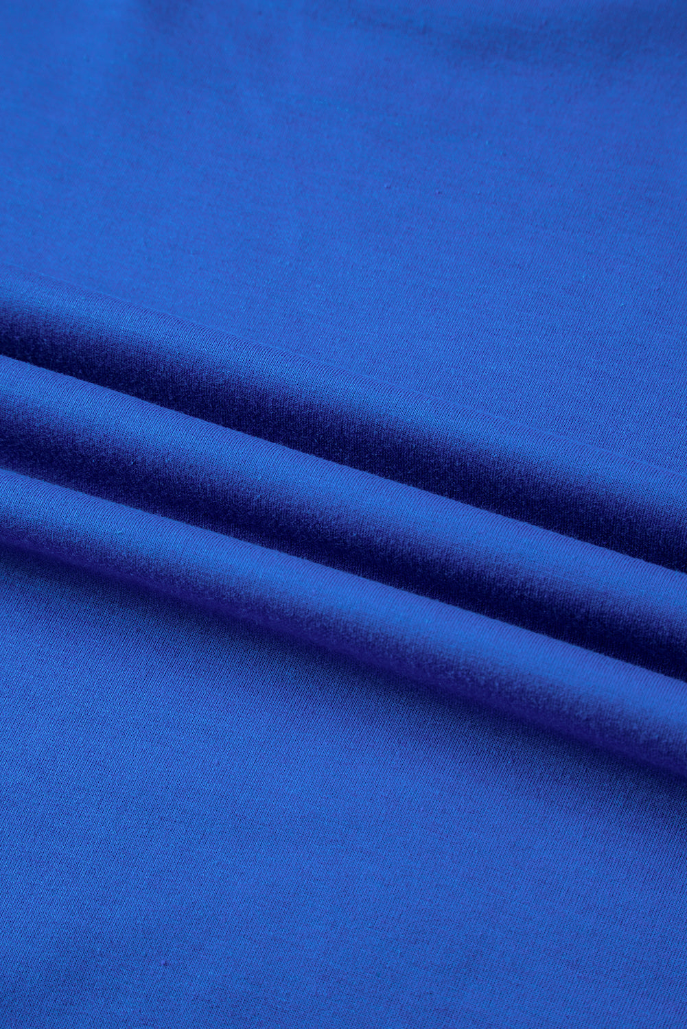 Blue oversized T-shirt by Mommas Hive featuring patched pocket and exposed seam details, made of polyester, cotton, and elastane.