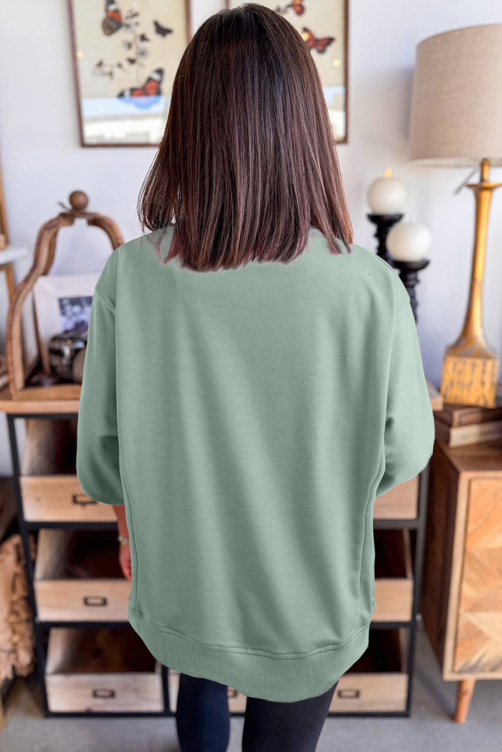 Floral patched half-sleeve tunic top by Mommas Hive in aqua with polyester, cotton, and elastane blend, featuring floral patch details.