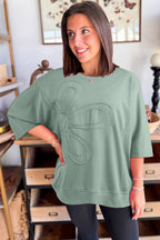 Mommas Hive floral patched half sleeve tunic top in aqua, made of polyester, cotton, and elastane, with colorful floral patches.
