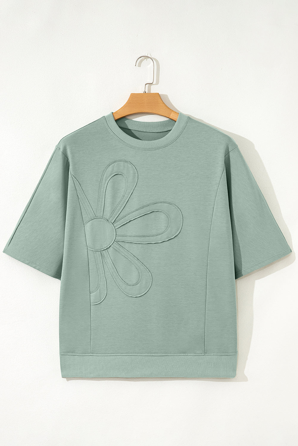 Mommas Hive floral patched half sleeve tunic top in aqua with polyester, cotton, and elastane, featuring floral patch details.