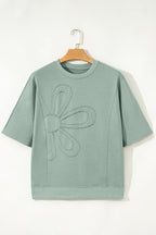 Mommas Hive floral patched half sleeve tunic top in aqua with polyester, cotton, and elastane, featuring floral patch details.