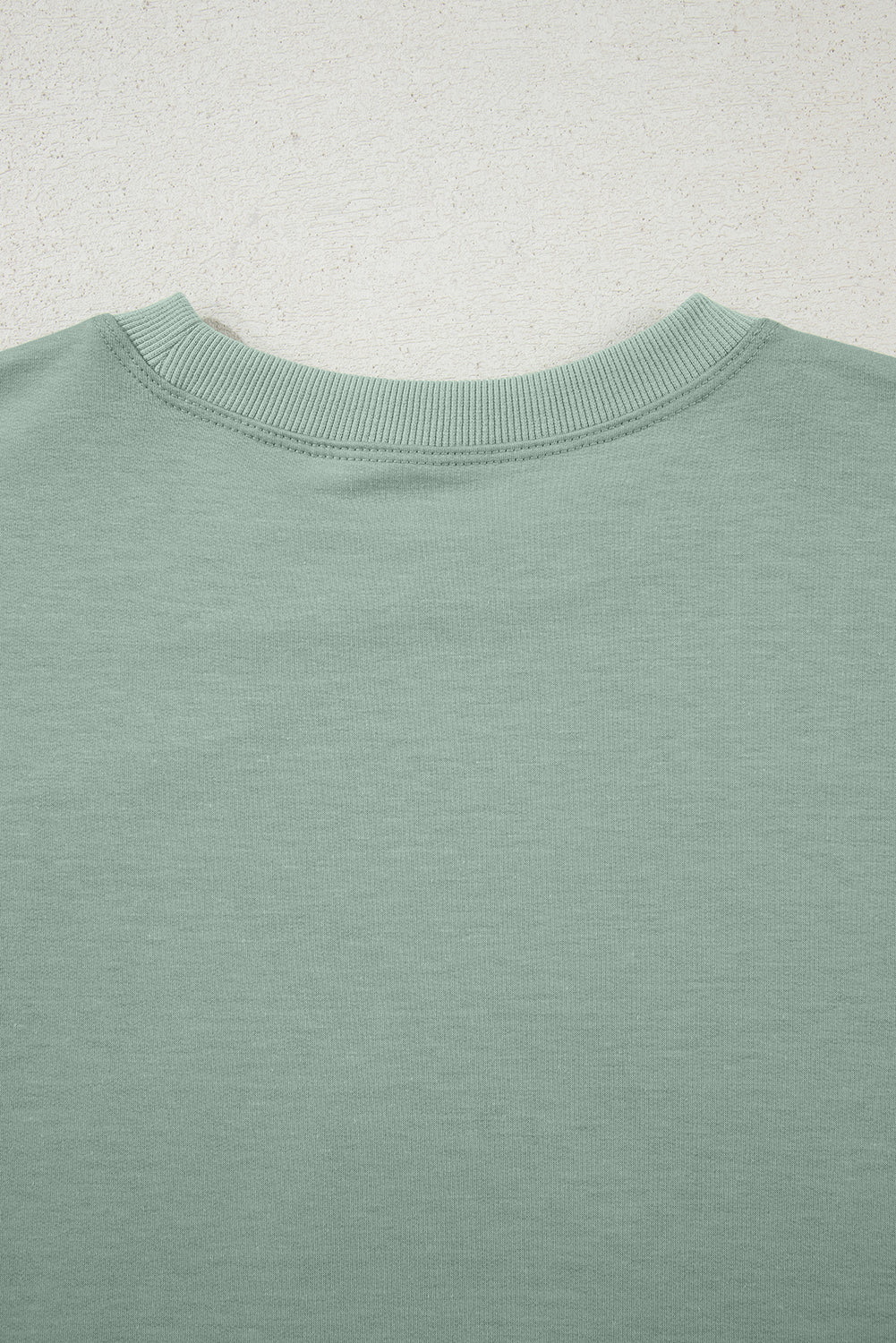 Mommas Hive floral patched half sleeve tunic top in aqua with polyester, cotton, and elastane fabric, featuring floral patch details.