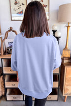 Mommas Hive floral patched half sleeve tunic top in aqua, made of polyester, cotton, and elastane, with a relaxed fit.