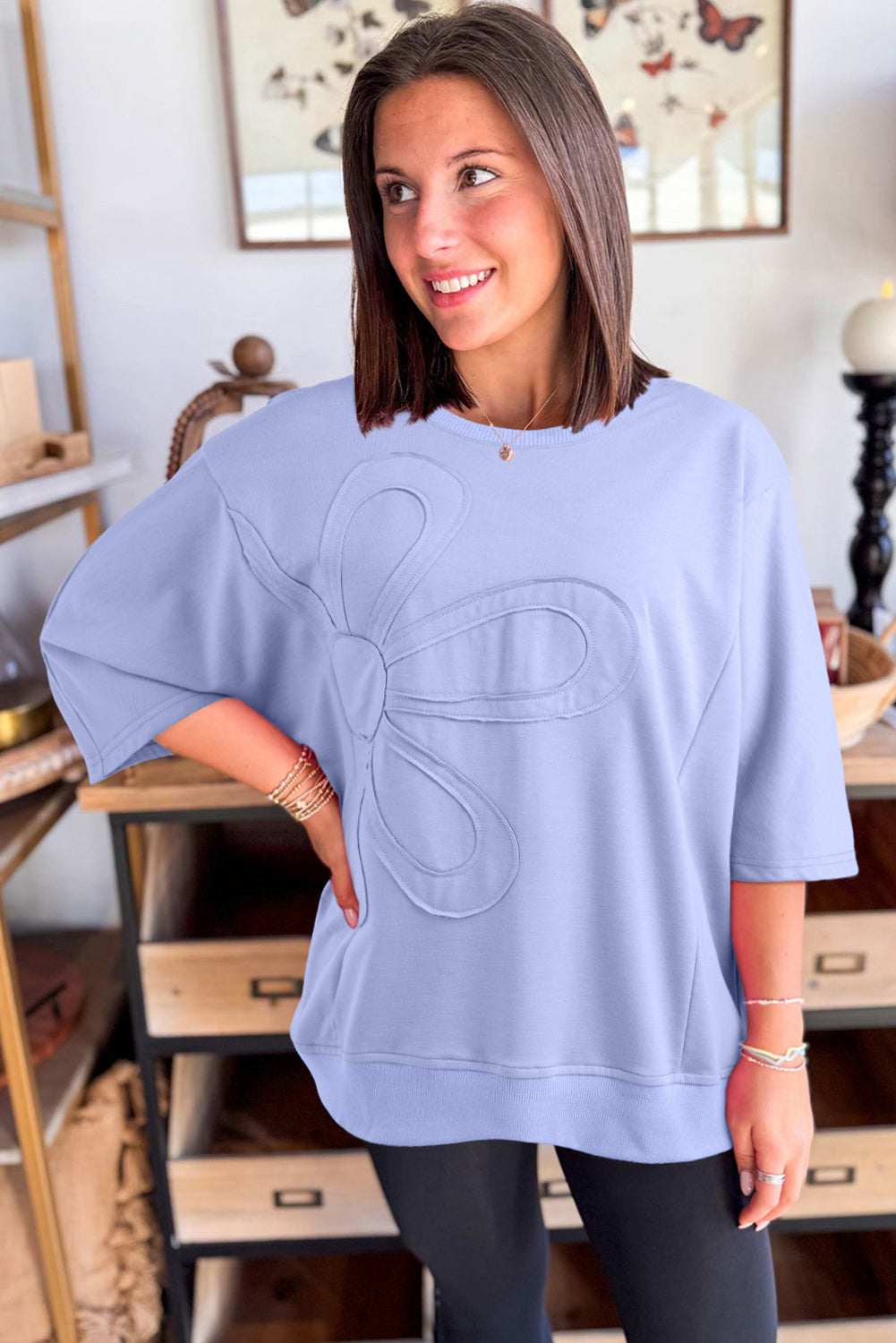 Mommas Hive floral patched half sleeve tunic top in aqua, made of polyester, cotton, and elastane, with floral patch details.