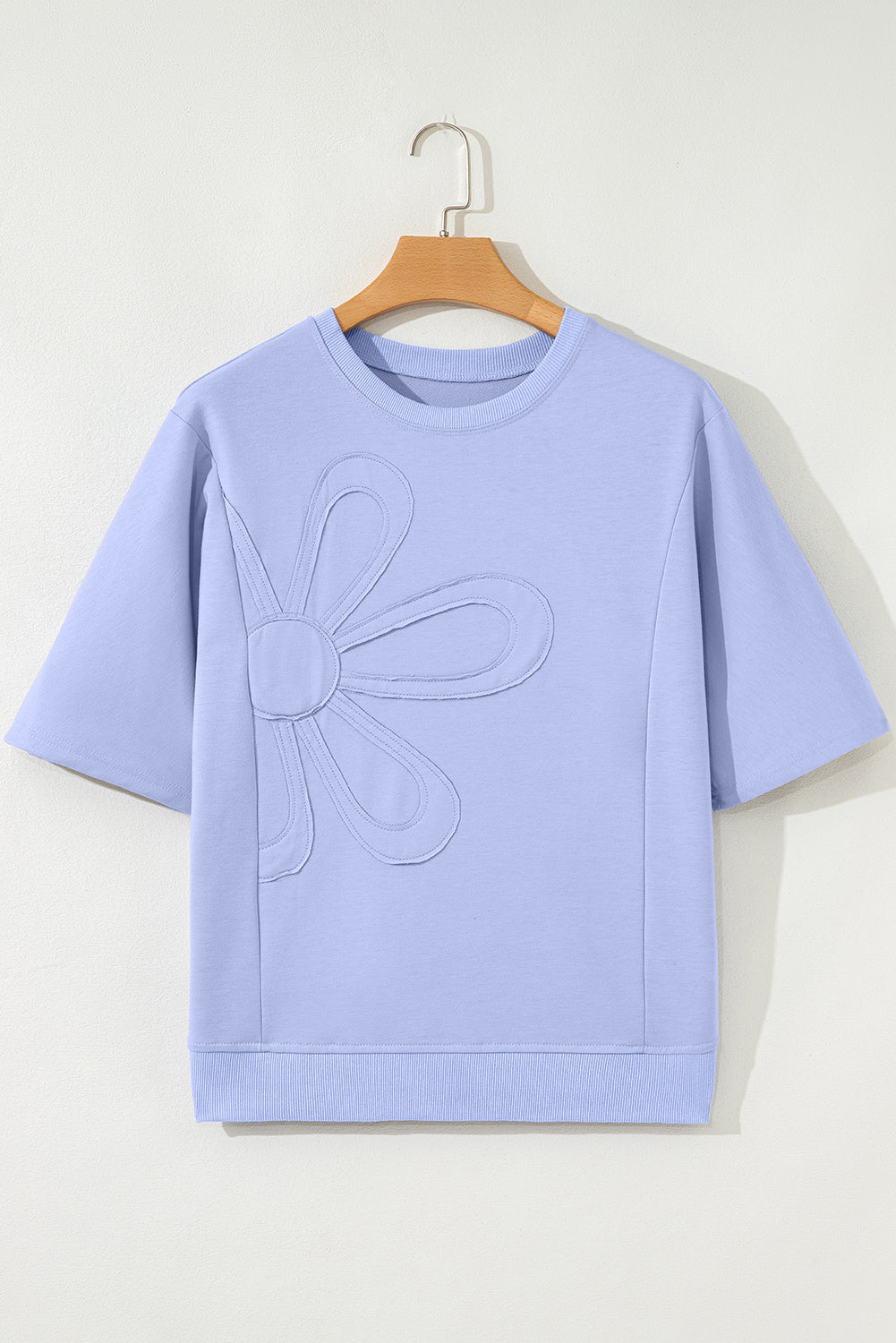Mommas Hive floral patched half-sleeve tunic top in aqua featuring colorful floral patches, made of polyester, cotton, and elastane.