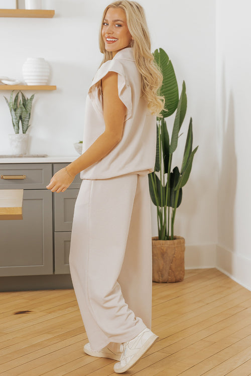 Apricot textured ruffled sleeve zipped top with wide-leg pants set by Mommas Hive, stylish two-piece polyester-elastane ensemble.