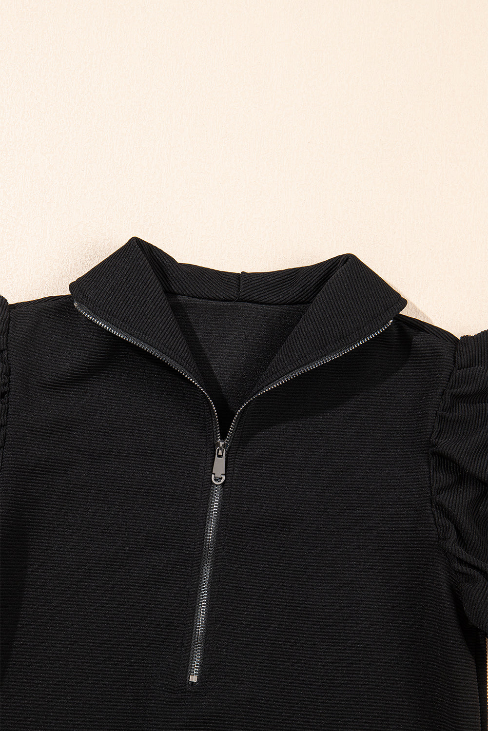 Black textured ruffled sleeve zipped top and wide-leg pants set from Mommas Hive, stylish two-piece outfit with modern details.