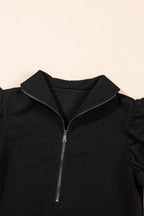 Black textured ruffled sleeve zipped top and wide-leg pants set from Mommas Hive, stylish two-piece outfit with modern details.