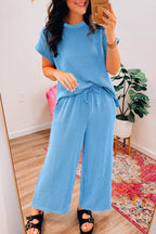 Blue solid corded knit short sleeve T-shirt and wide-leg pants set by Mommas Hive, casual two-piece knit summer outfit.