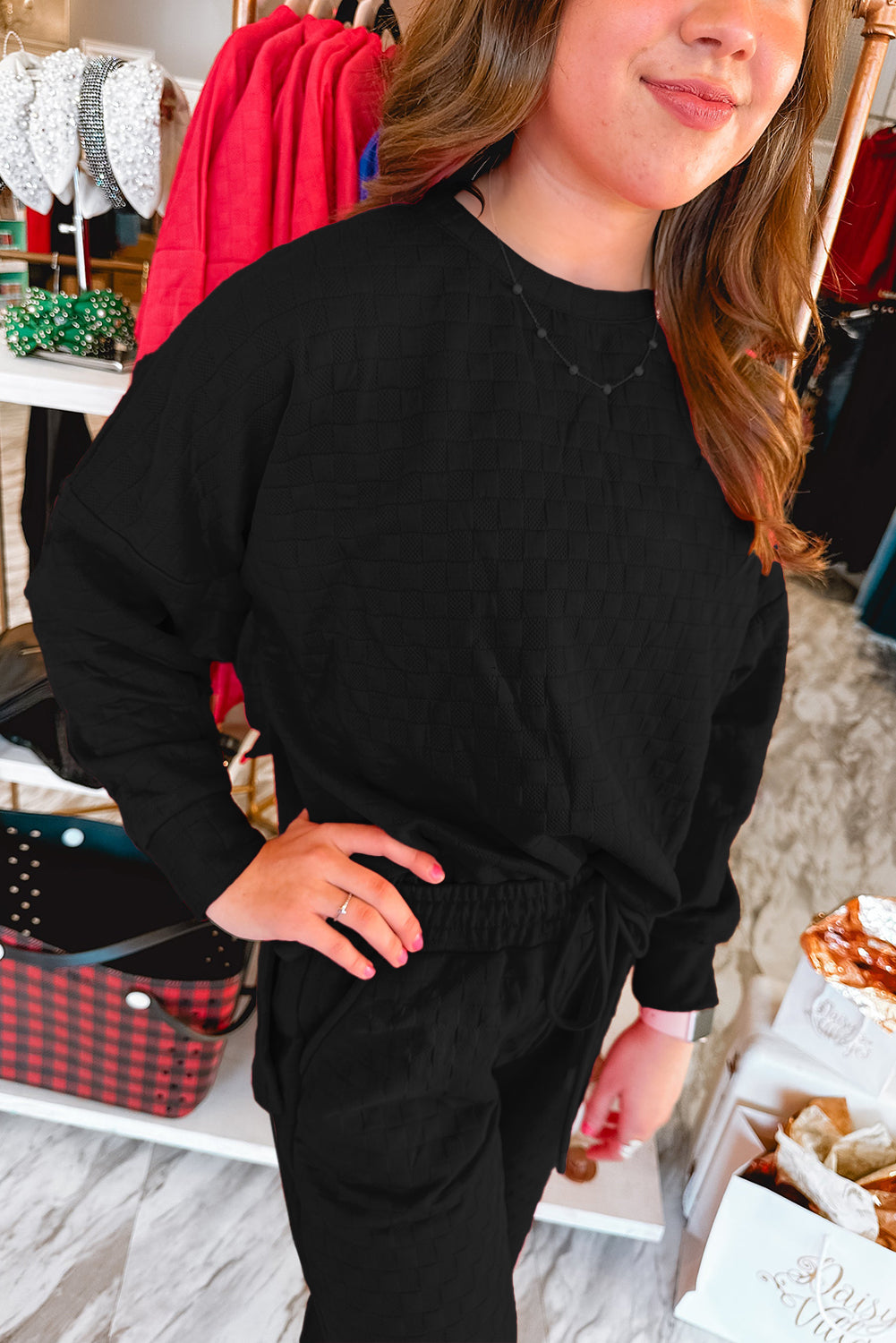 Checkered textured black split pullover top and matching pants set by Mommas Hive, featuring a stylish two-piece design.