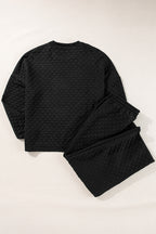 Mommas Hive checkered textured split pullover top and matching pants set in black, featuring a stylish two-piece design.