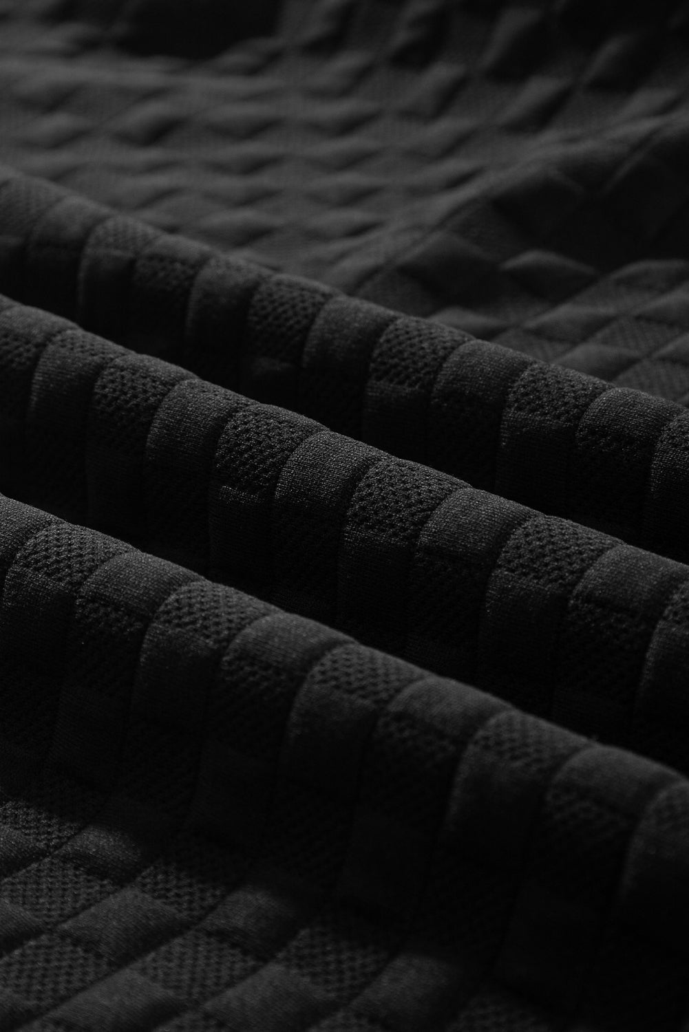 Mommas Hive black checkered textured split pullover top and matching pants set, stylish two-piece outfit for casual wear.