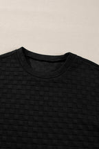 Black checkered textured split pullover top and matching pants set from Mommas Hive, stylish two-piece outfit with a comfortable fit.