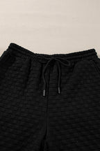 Black checkered textured split pullover top and matching pants set by Mommas Hive, stylish two-piece outfit with comfortable fit.