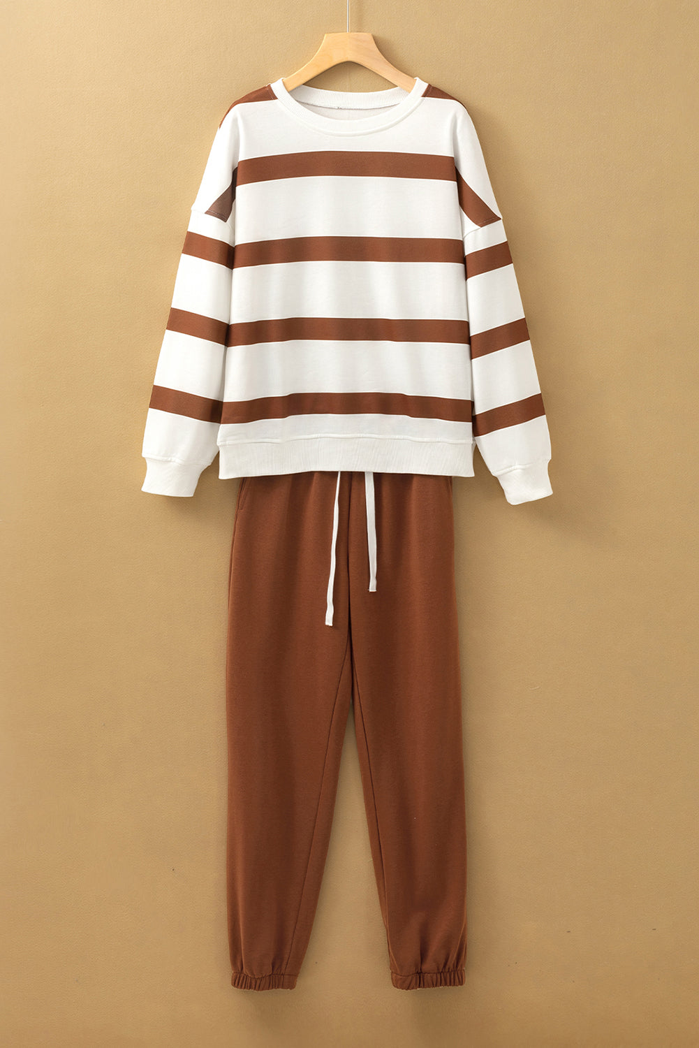 Black stripe drop shoulder pullover with matching jogger pants set by Mommas Hive, made of polyester, casual two-piece outfit.