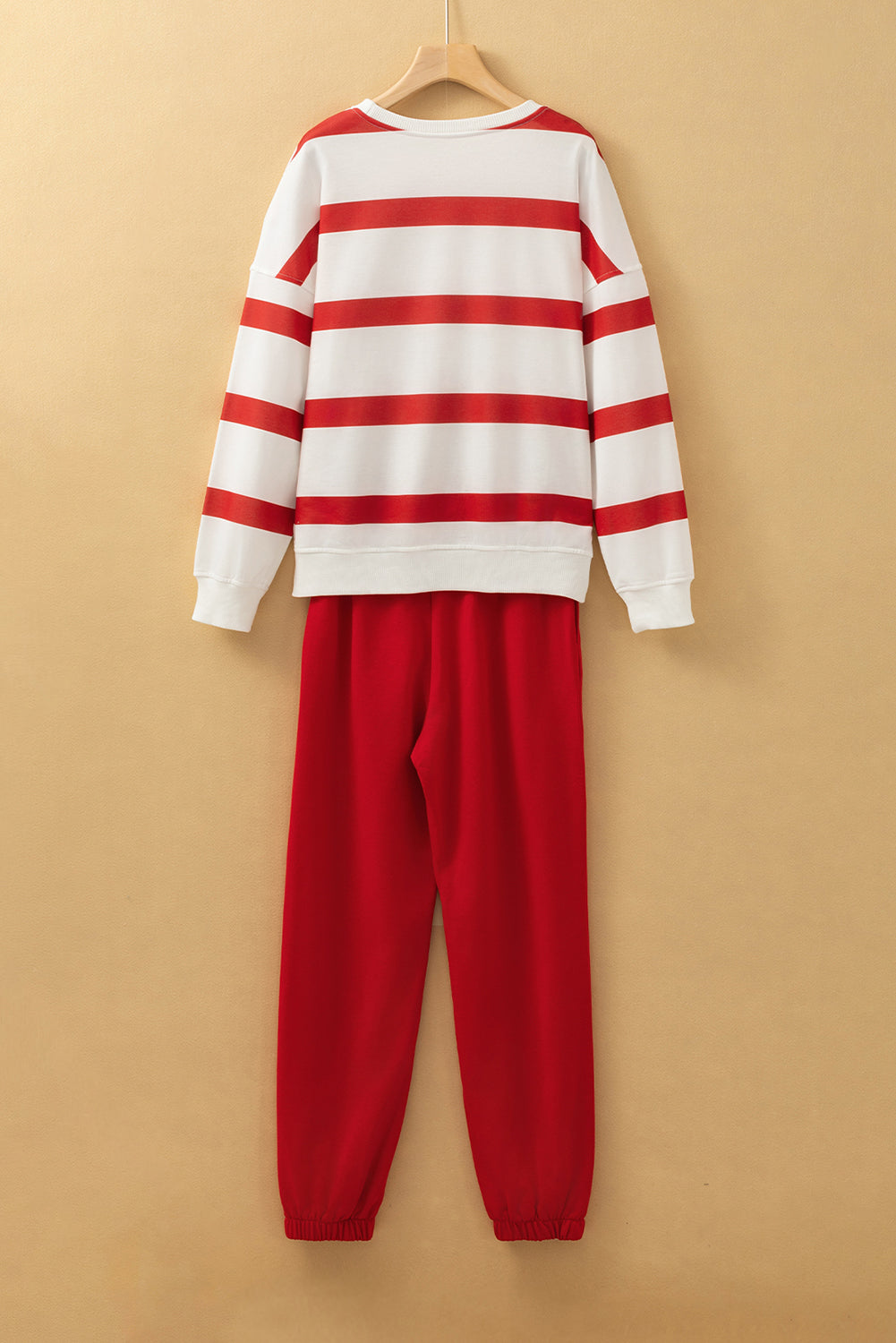 Black stripe drop shoulder pullover and jogger pants set by Mommas Hive, featuring a relaxed fit and stylish two-piece design.