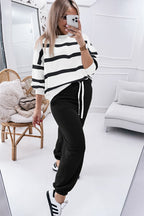 Black stripe drop shoulder pullover and jogger pants set from Mommas Hive, featuring a relaxed fit and comfortable fabric.