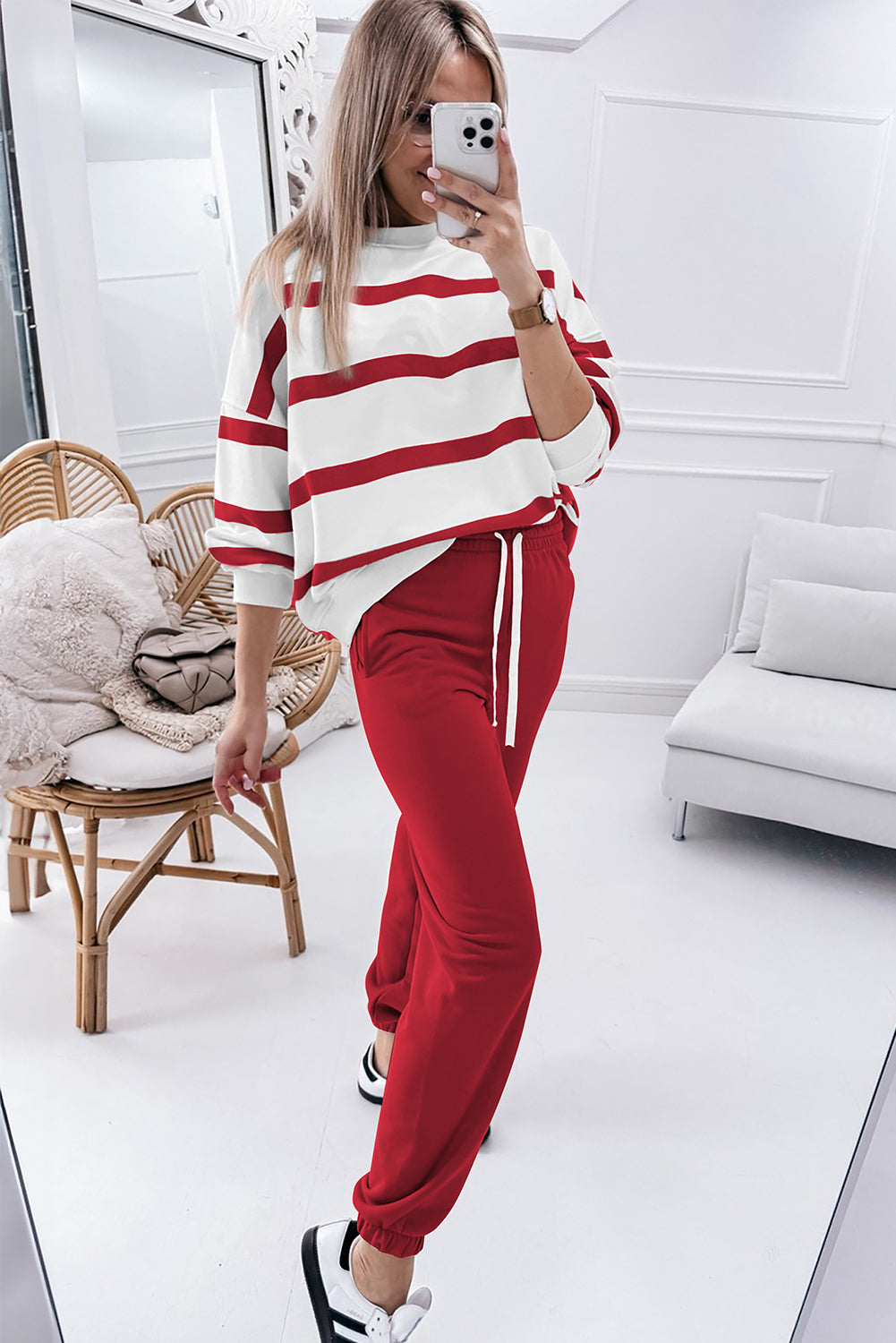 Mommas Hive black stripe drop shoulder pullover and jogger pants set, stylish two-piece outfit with red stripe details, made of polyester.