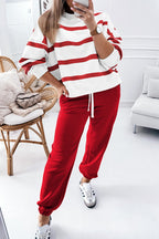 Black stripe drop shoulder pullover and jogger pants set from Mommas Hive, featuring a relaxed fit and comfortable polyester fabric.