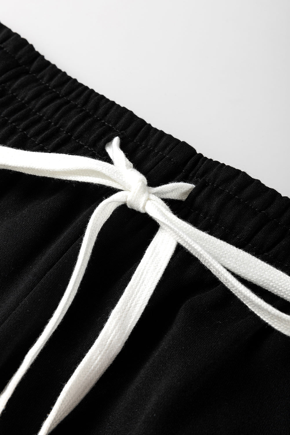 Mommas Hive black stripe drop shoulder pullover and matching jogger pants set, two-piece outfit with red stripe details.