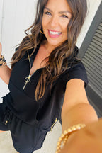 Black textured two-piece shorts set by Mommas Hive featuring a half-zip kangaroo pocket top and drawstring shorts.