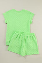 Light green checkered textured tee and drawstring shorts from Mommas Hive two-piece set, casual and comfortable for everyday wear.