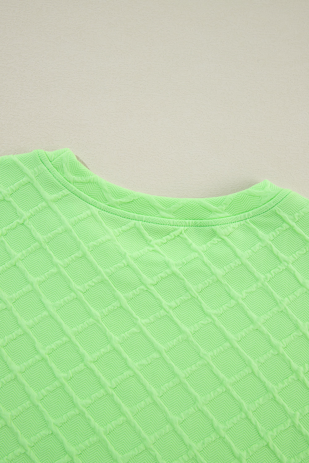 Light green checkered textured tee and drawstring shorts two-piece set by Mommas Hive, casual and comfortable for everyday wear.