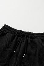 Mommas Hive textured ruffle split top and drawstring shorts two-piece set, featuring a stylish ruffle top and comfortable shorts.