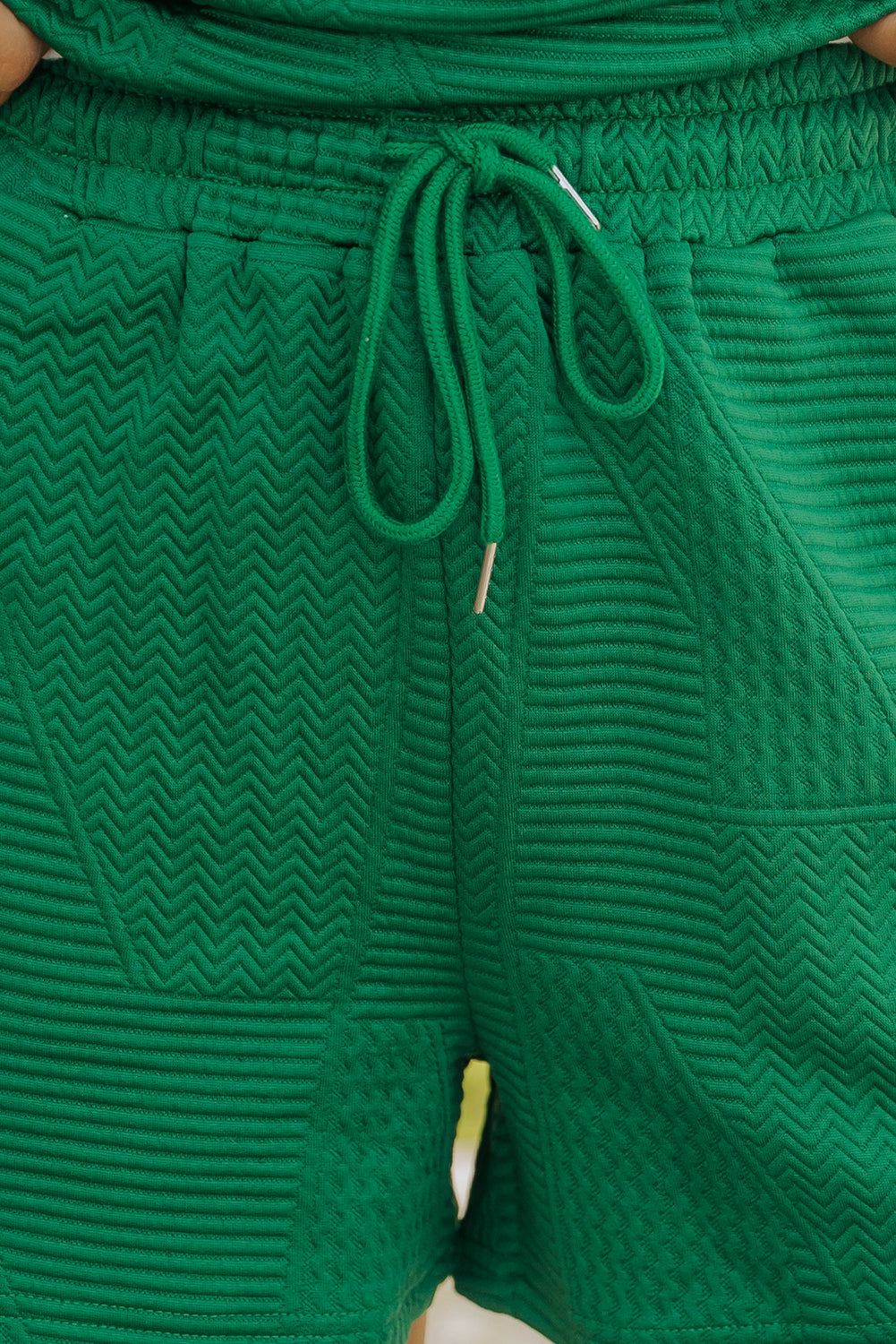 Mommas Hive textured ruffle split top and drawstring shorts two-piece set, polyester-elastane fabric, casual summer style.