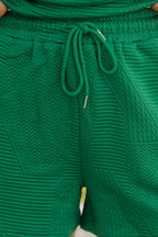 Mommas Hive textured ruffle split top and drawstring shorts two-piece set, polyester-elastane fabric, casual summer style.