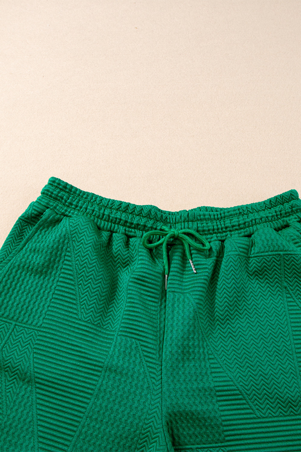 Mommas Hive textured ruffle split top and drawstring shorts two-piece set, featuring short sleeves and relaxed fit.